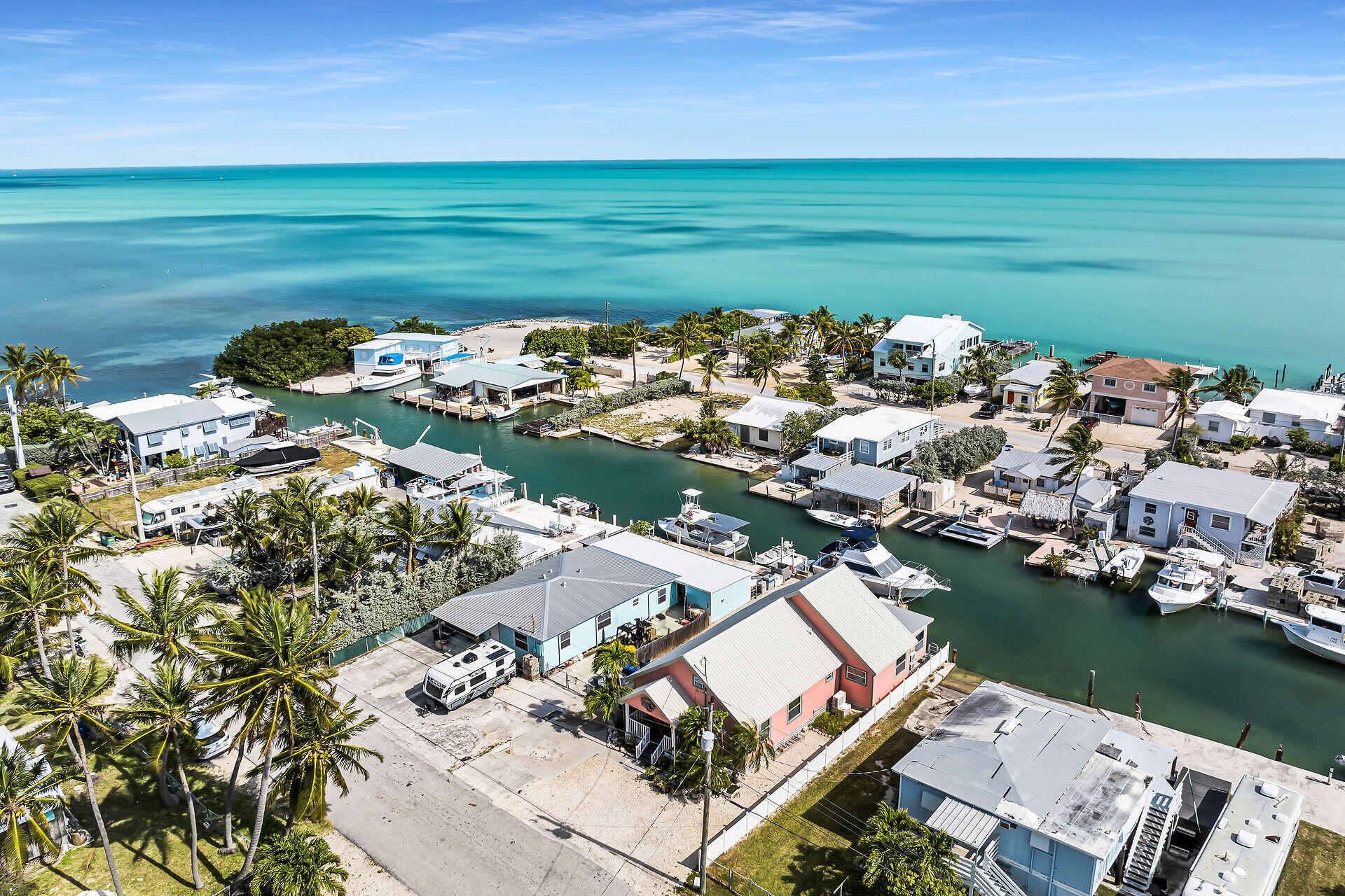 an aerial view of a house with a lake view