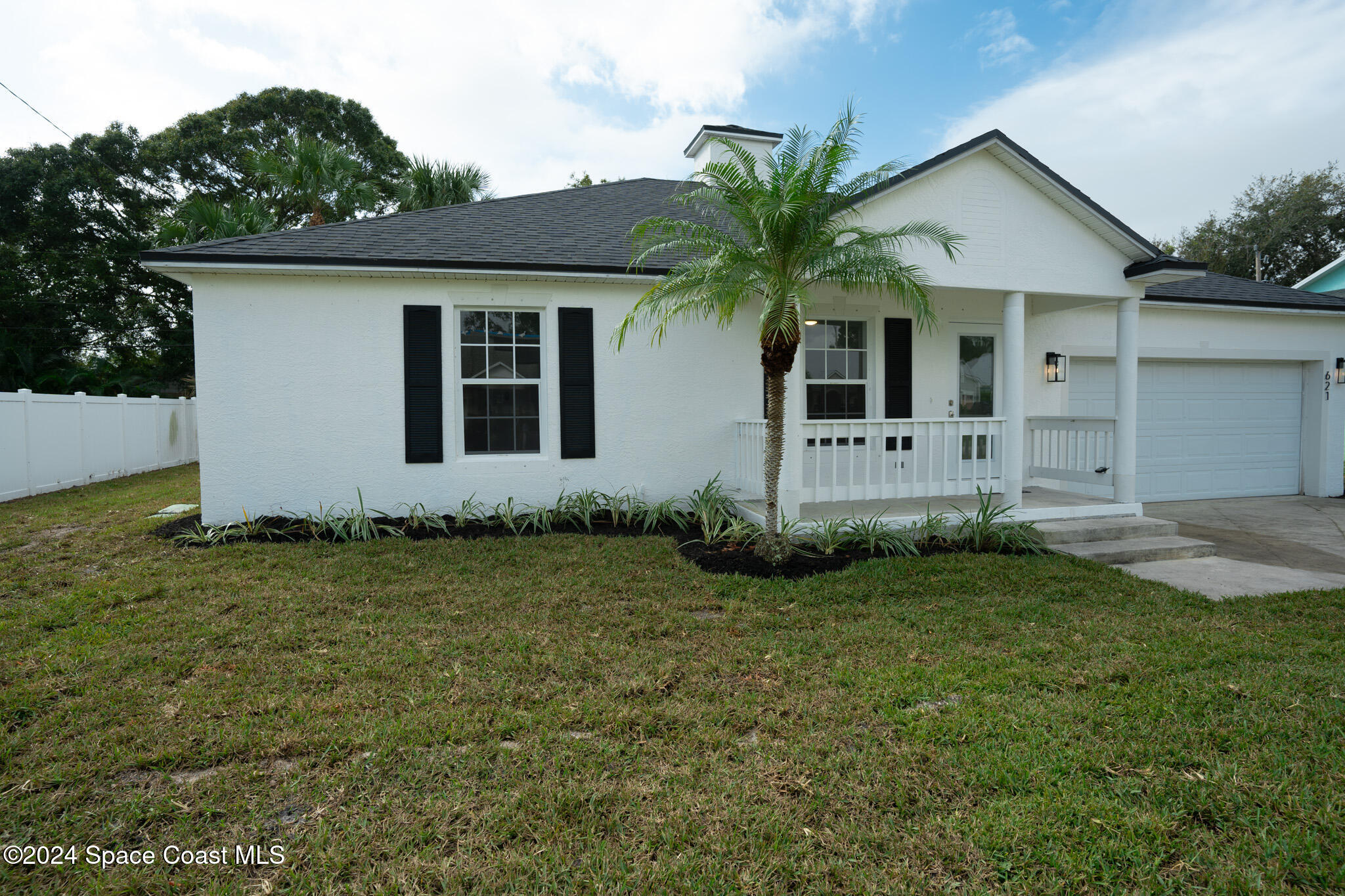 front view of a house with a yard