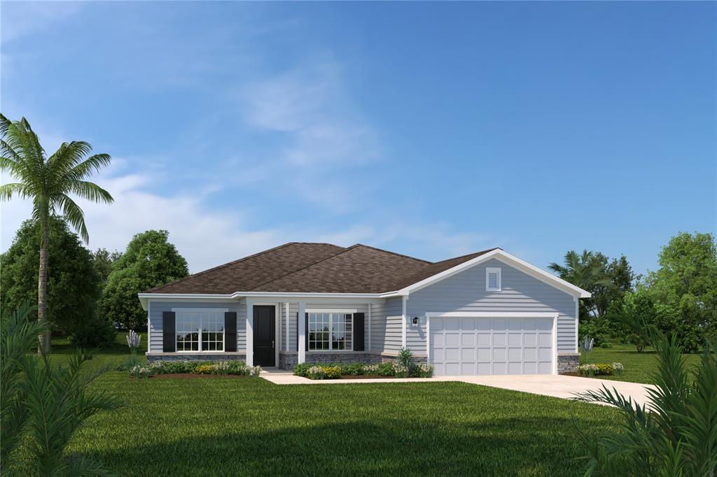 a front view of a house with a yard and trees