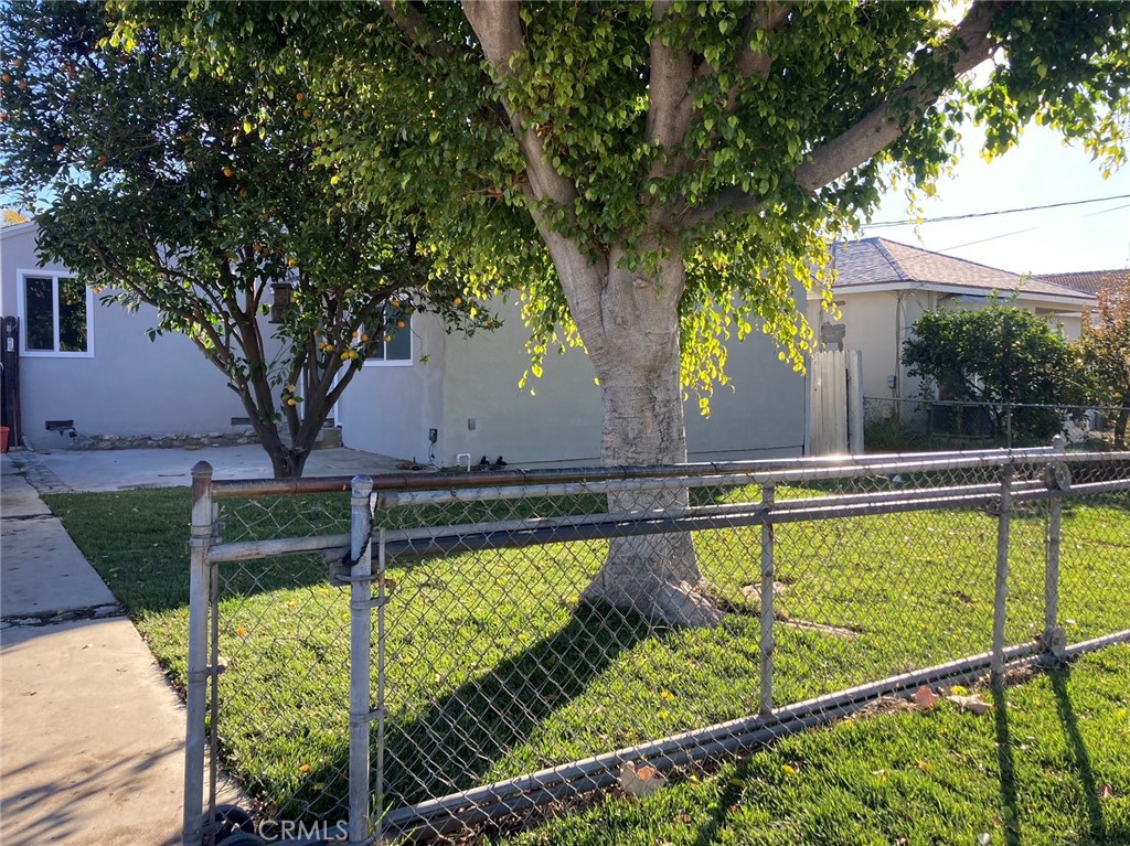 a view of a swimming pool with a patio and a yard