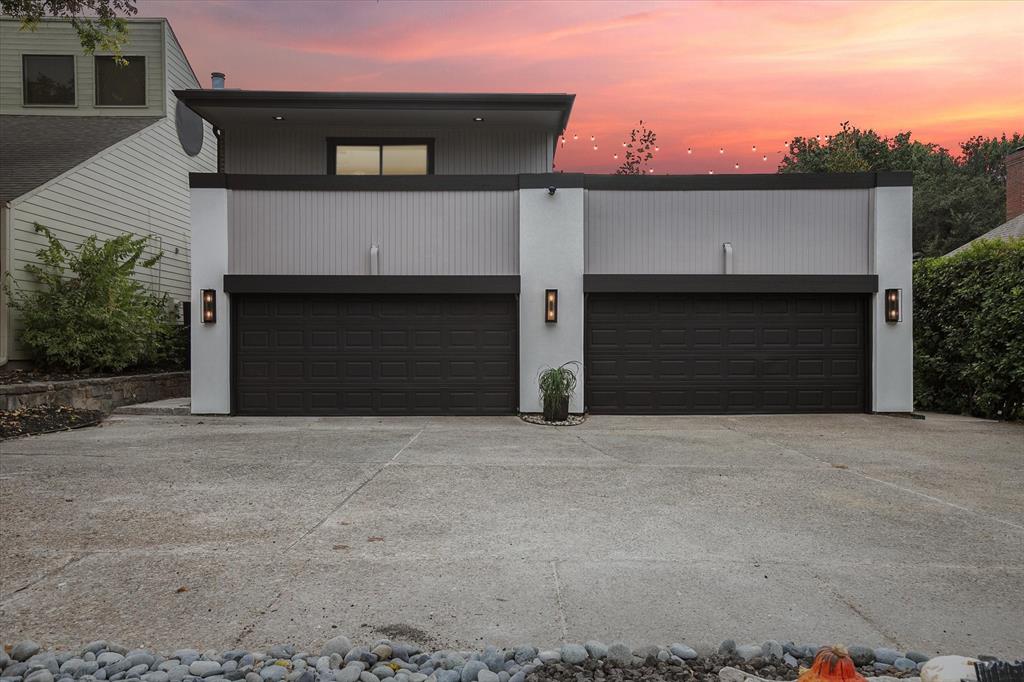 a front view of a house with a garage