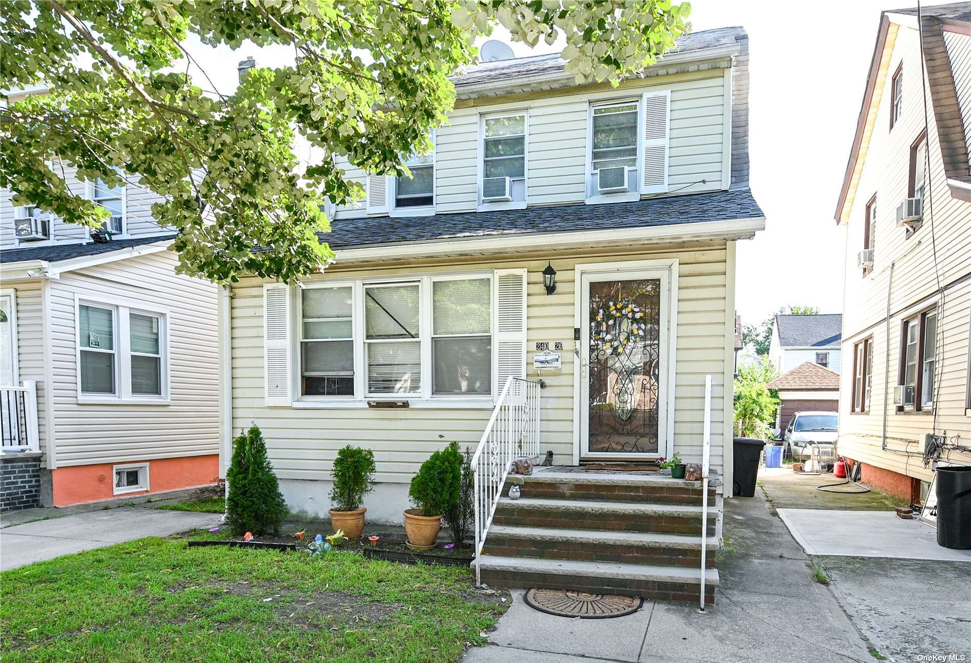 a front view of a house with garden