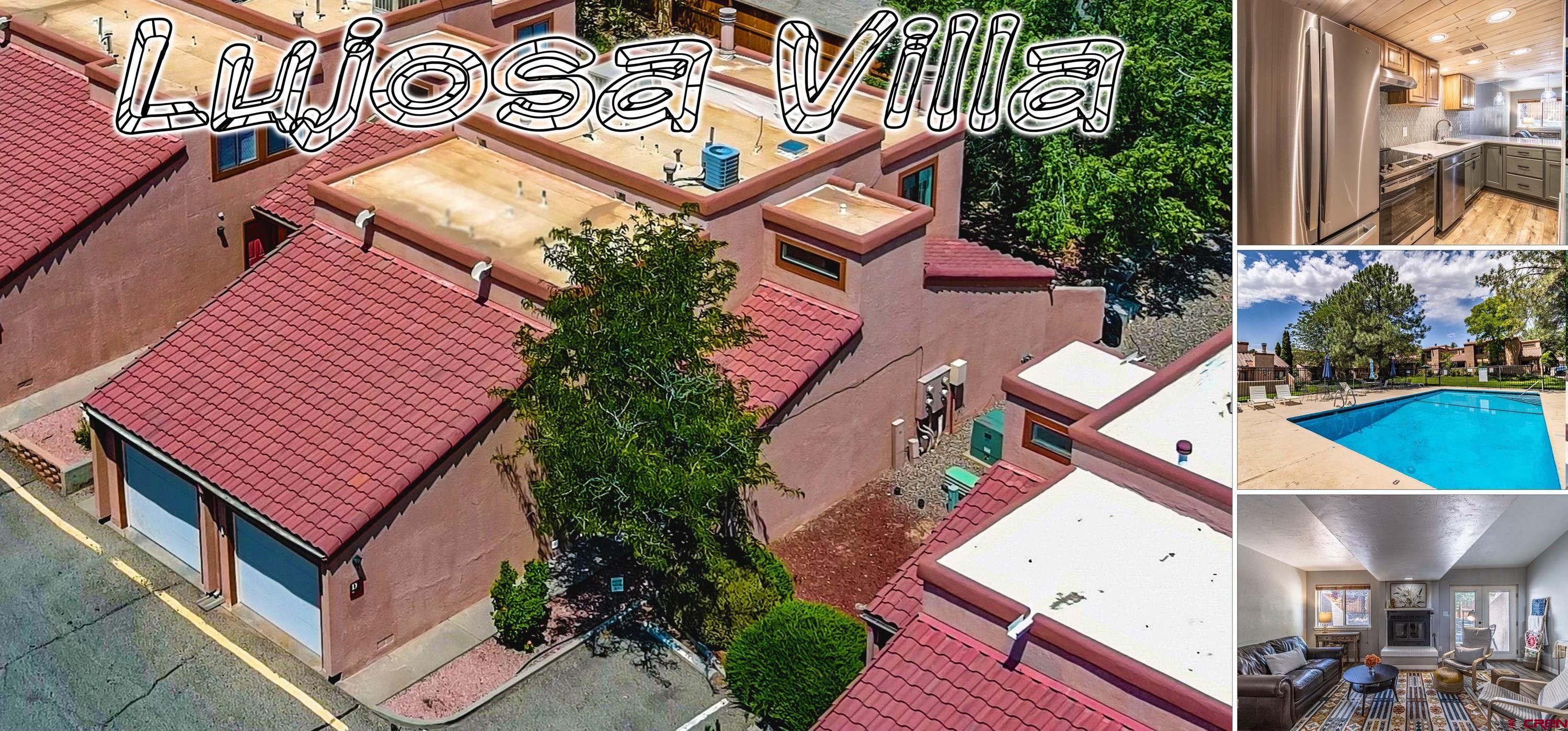 an aerial view of a house with a yard and potted plants