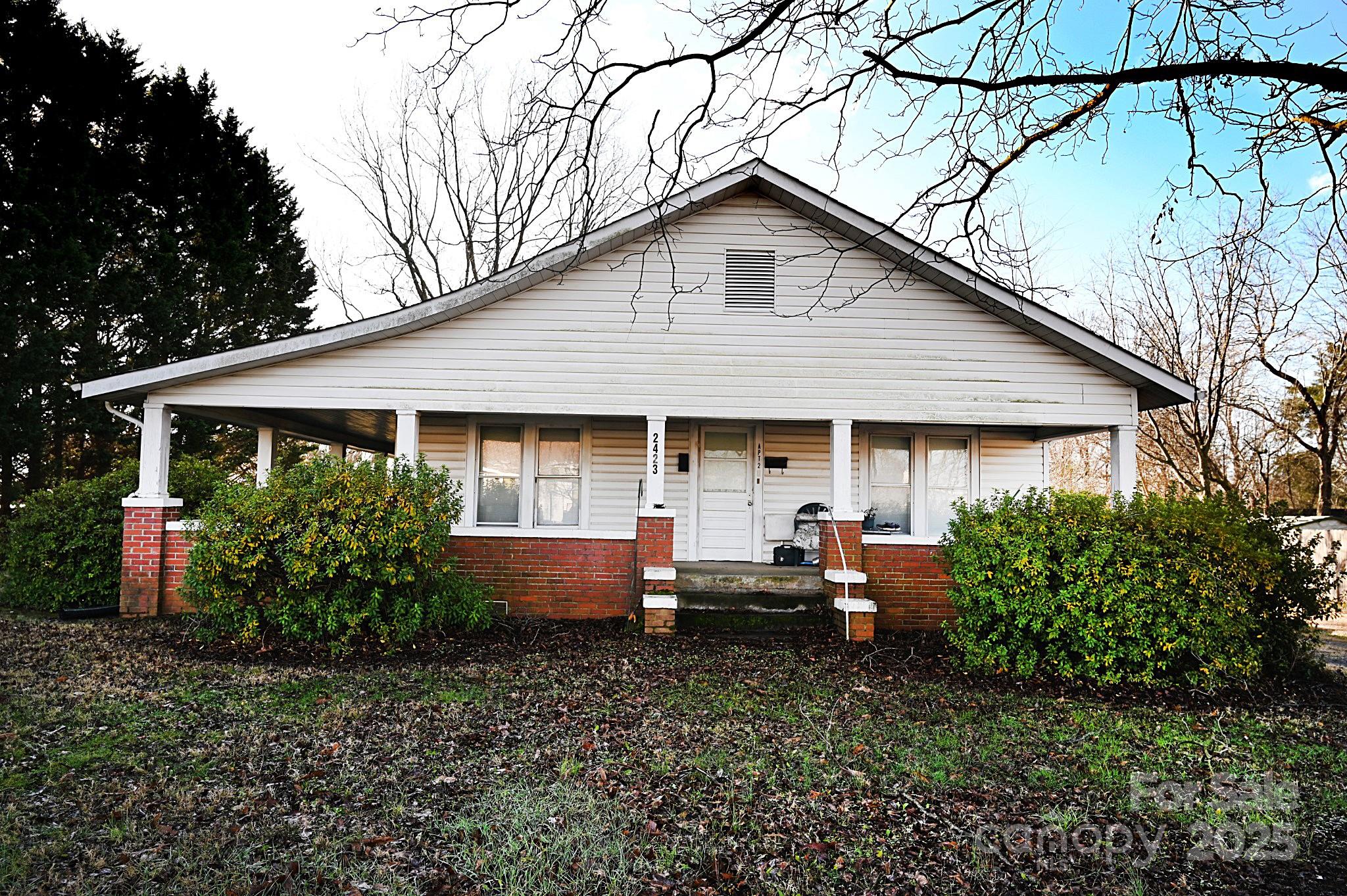 a front view of house with an outdoor seating