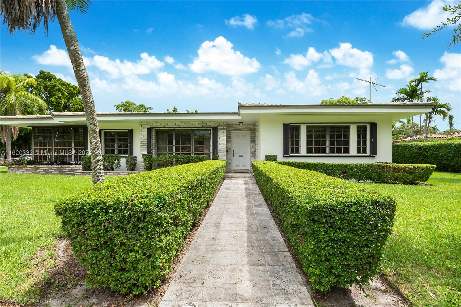 front view of a house with a yard