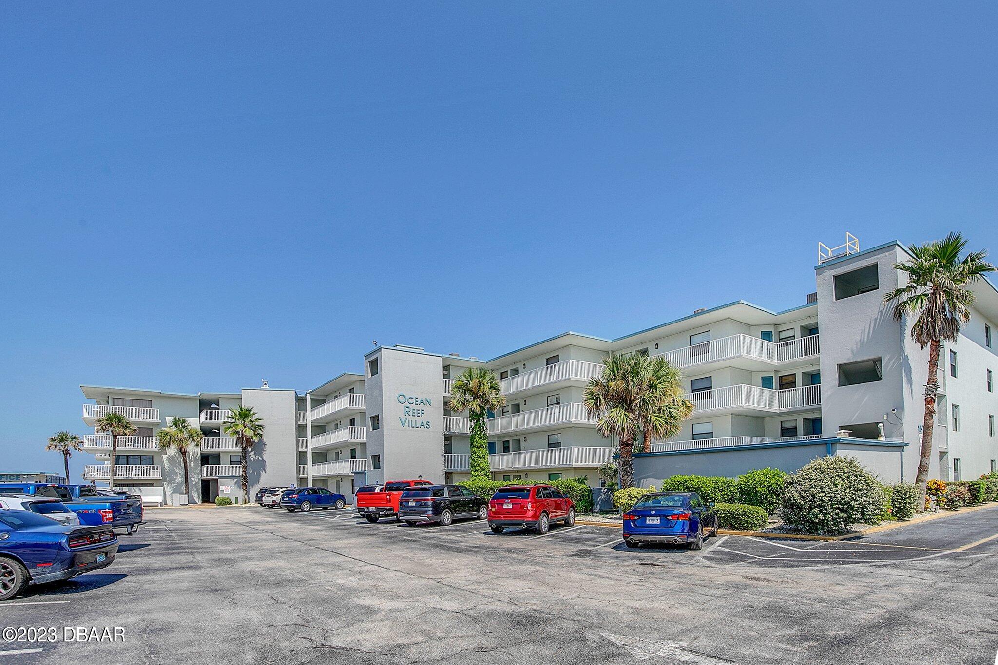 a building with cars parked in front of it