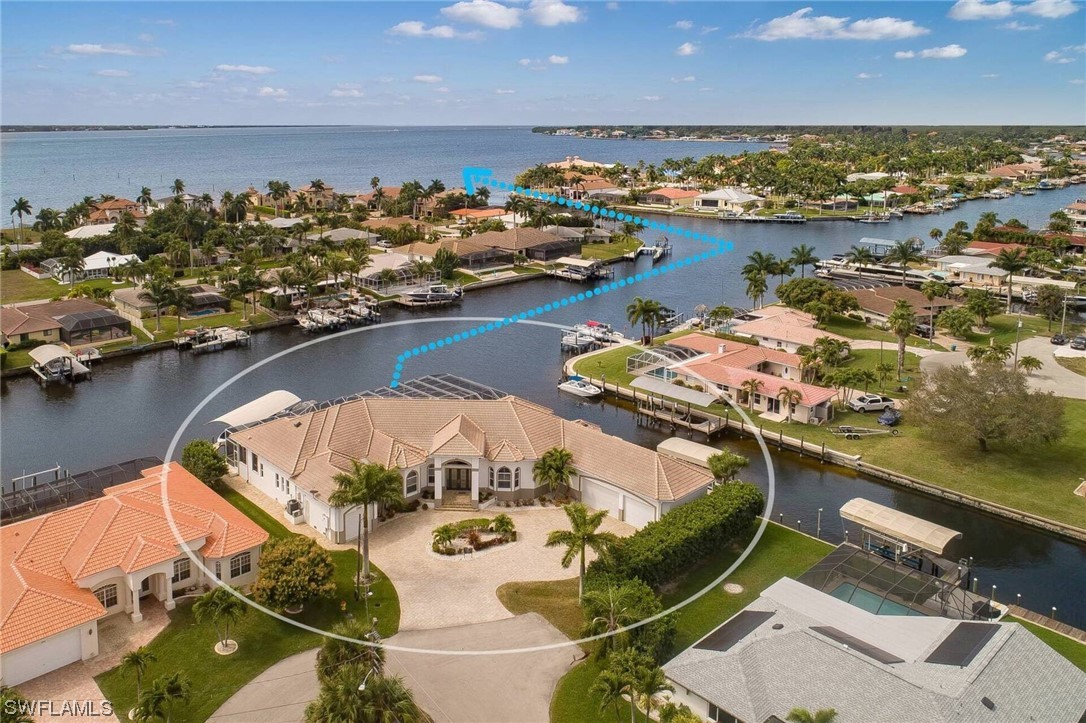 an aerial view of a house with a ocean view