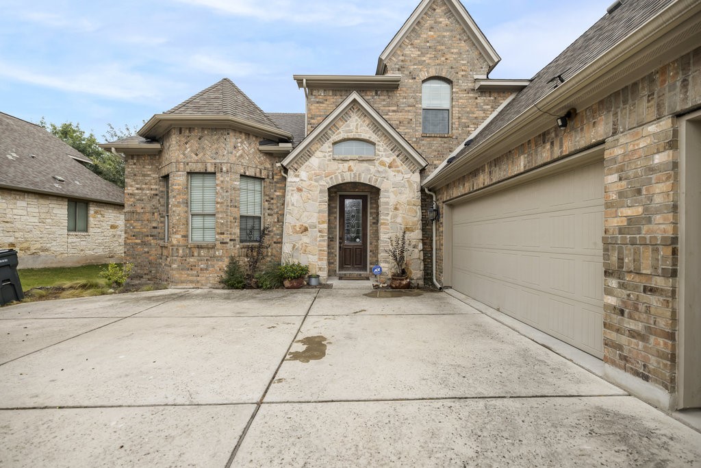 a front view of a house with yard