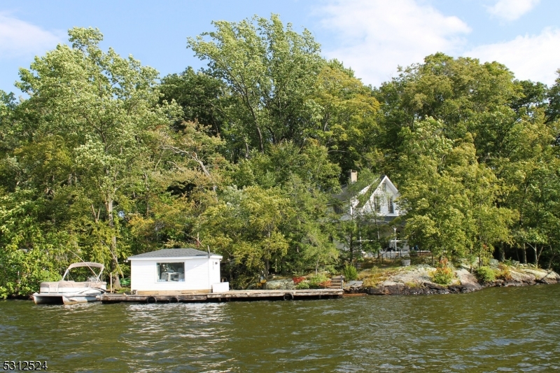 a house with swimming pool in front of it