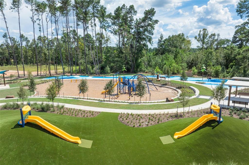 swimming pool with outdoor seating and yard