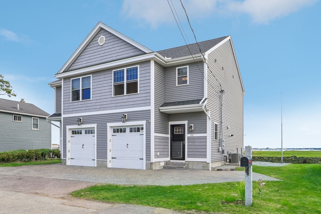 front view of a house with a yard