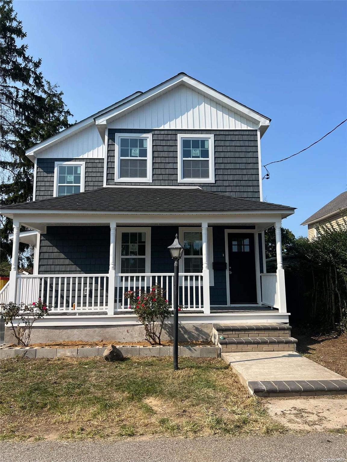 a front view of a house with a porch