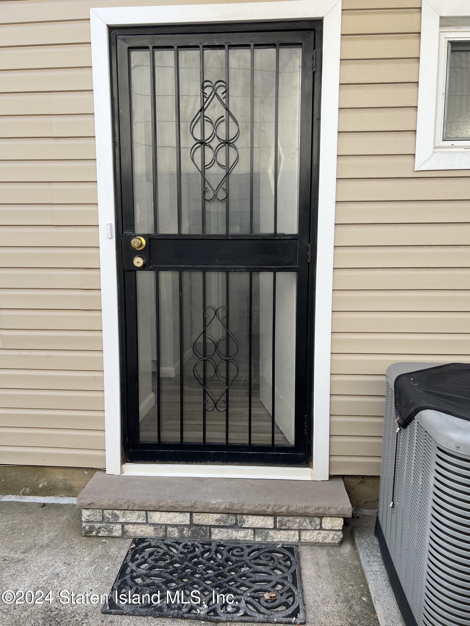 a view of a door and a window