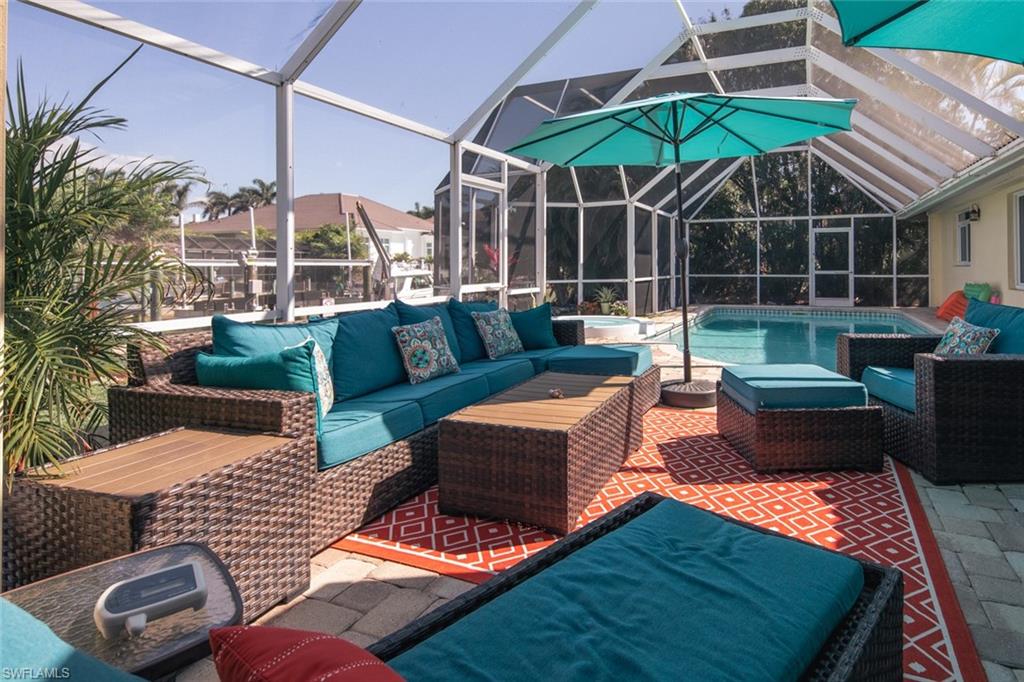 a view of an outdoor sitting area with furniture and garden