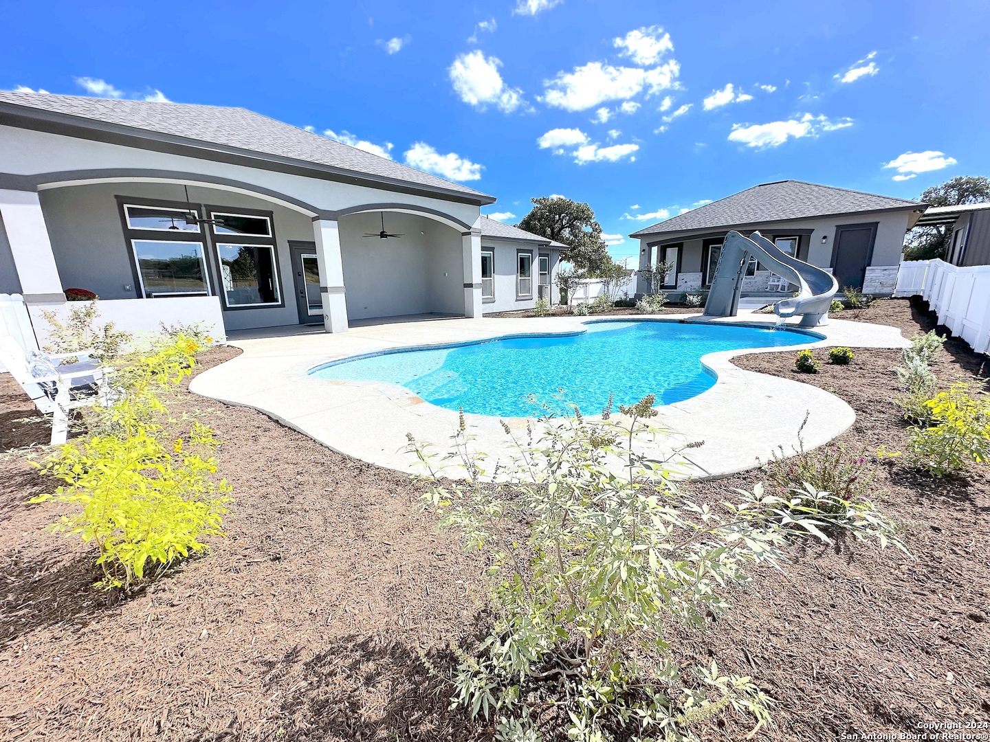 a view of a house with swimming pool