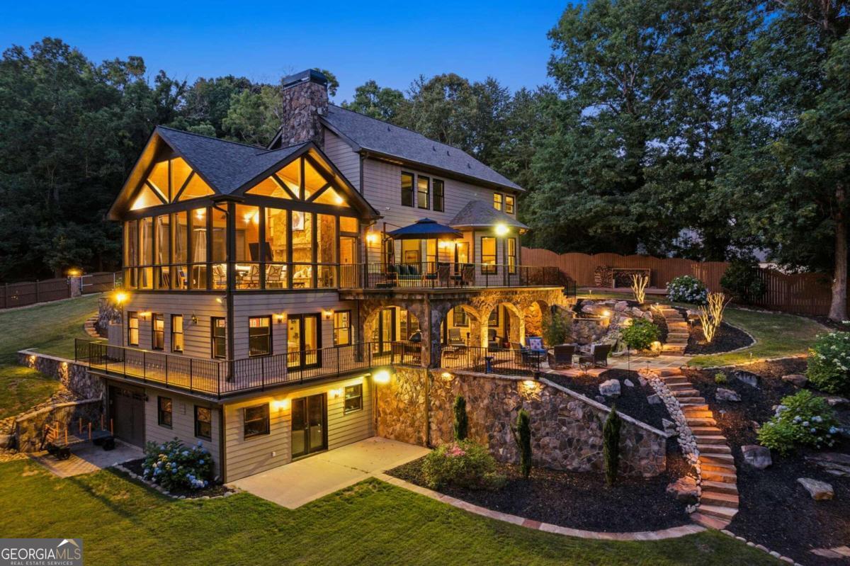 a view of swimming pool with outdoor seating and yard in the back