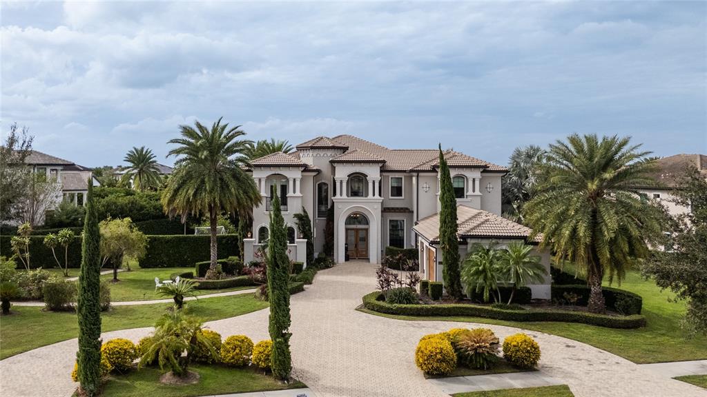 a front view of a house with swimming pool and porch