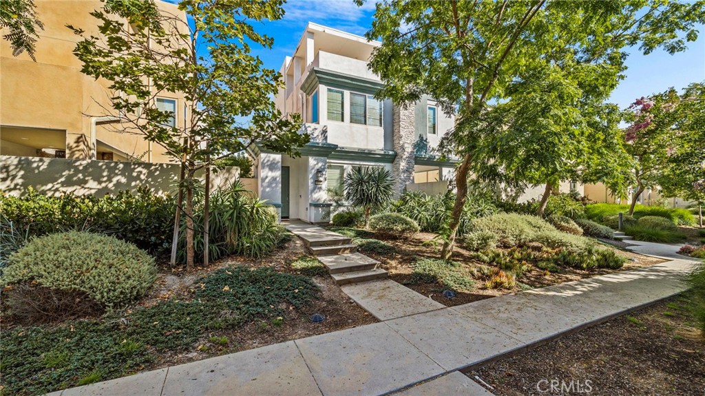 a front view of a house with trees