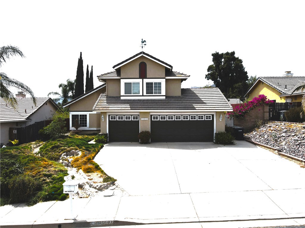 a front view of a house with yard