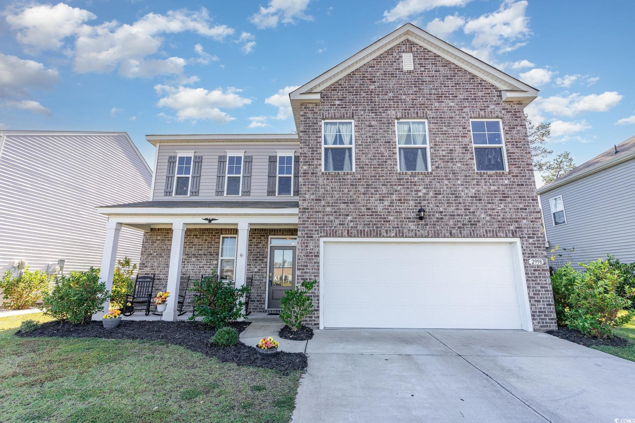 View of front of property featuring covered porch,