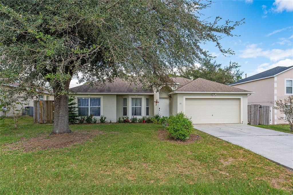 front view of a house and a yard