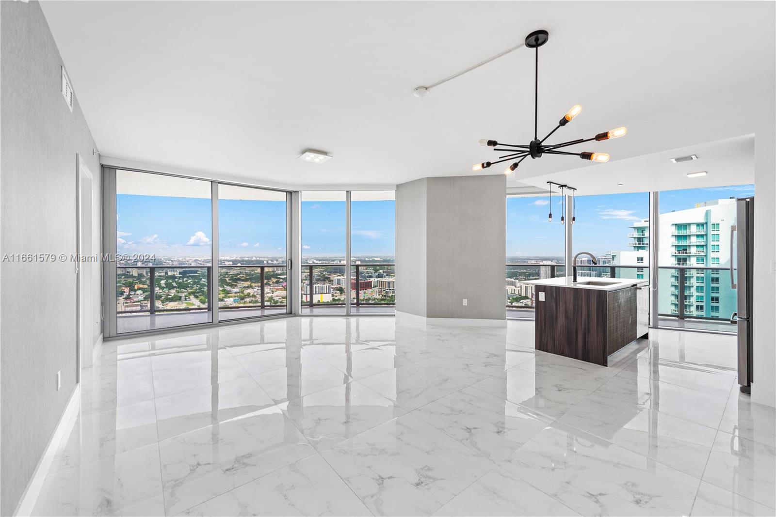 a view of a living room and kitchen view