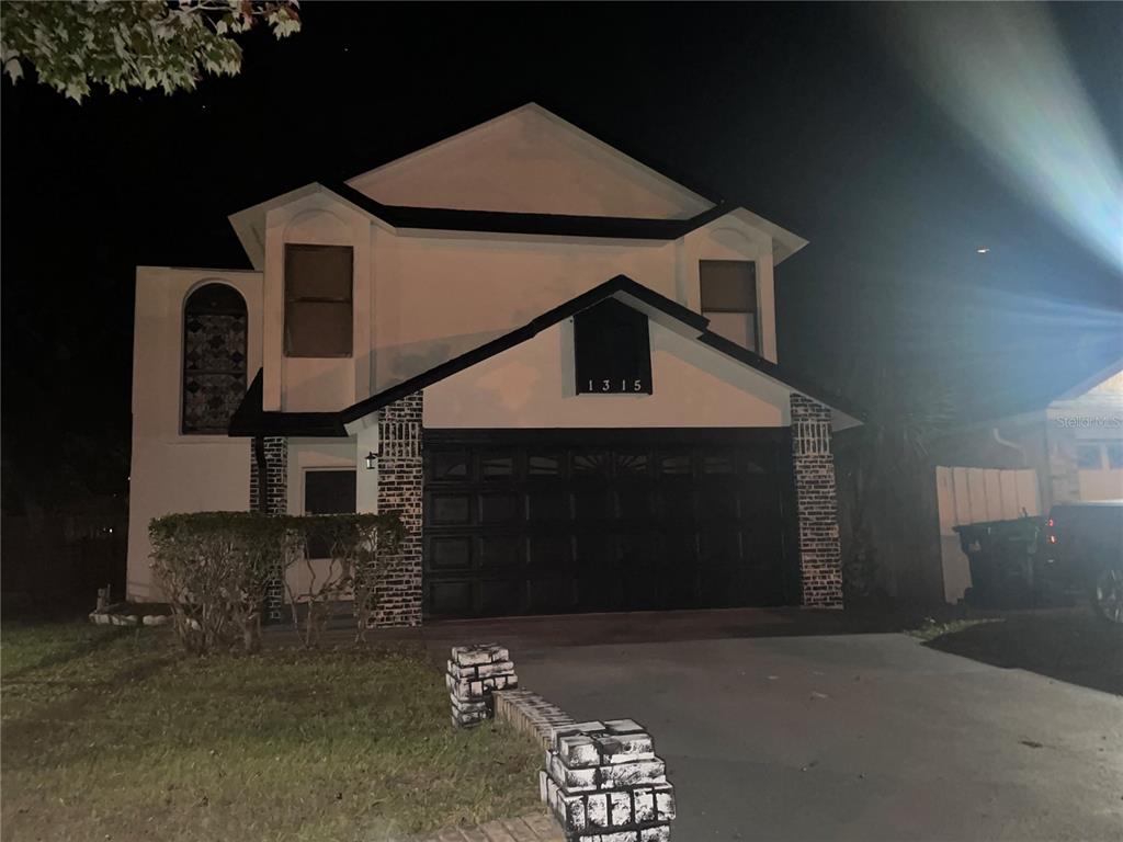 a front view of a house with a garage