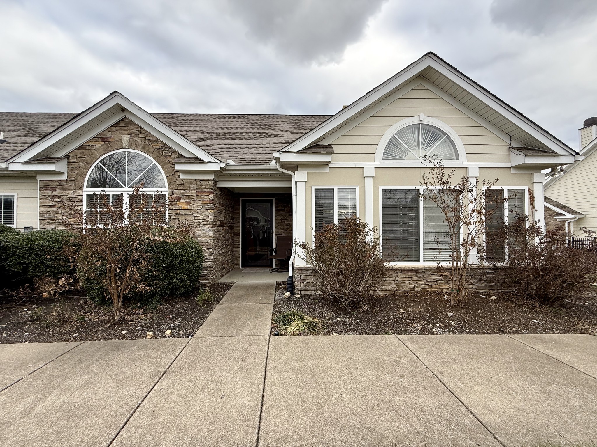 a front view of a house with garden