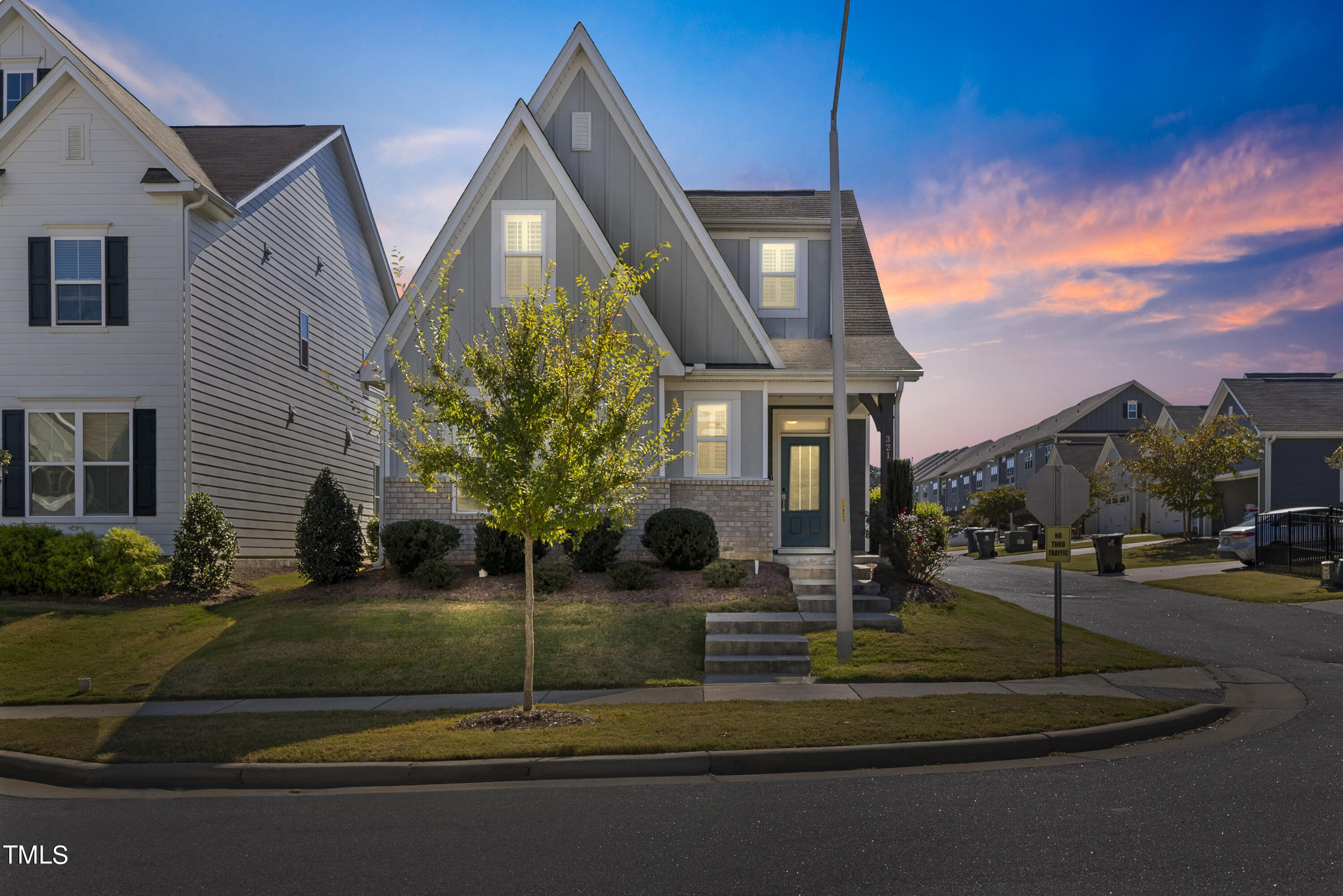 a front view of a house with a yard