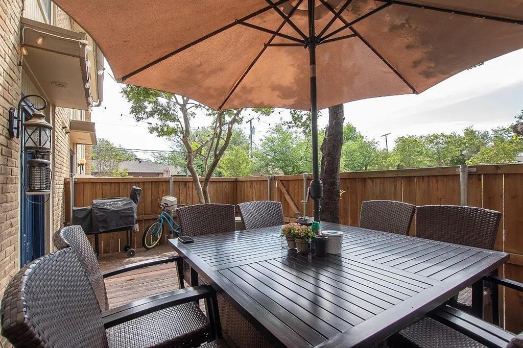 a view of a roof deck with furniture