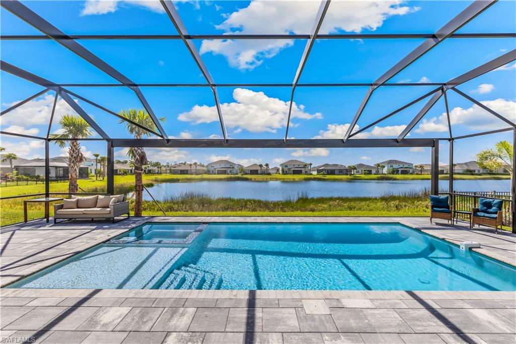 a view of swimming pool with seating area