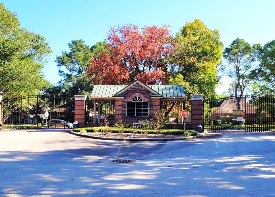 a front view of a house with a fountain