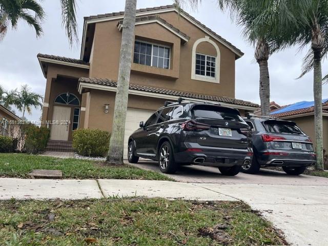 a car parked in front of a house