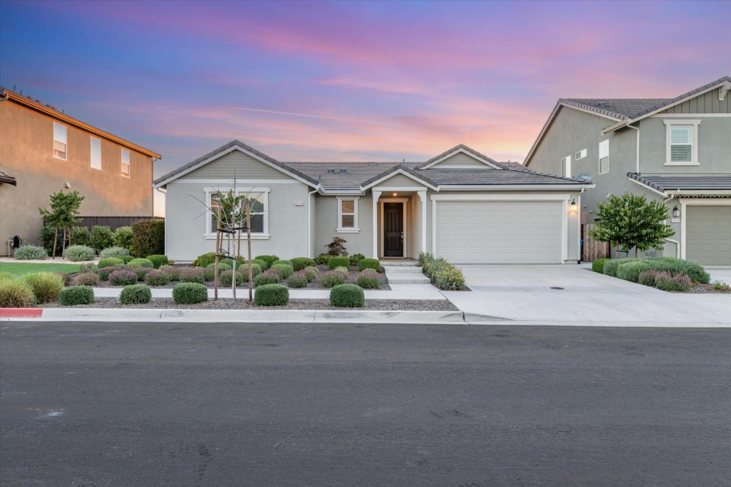 front view of a house with a small yard