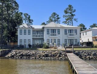 a front view of a house with a lake view