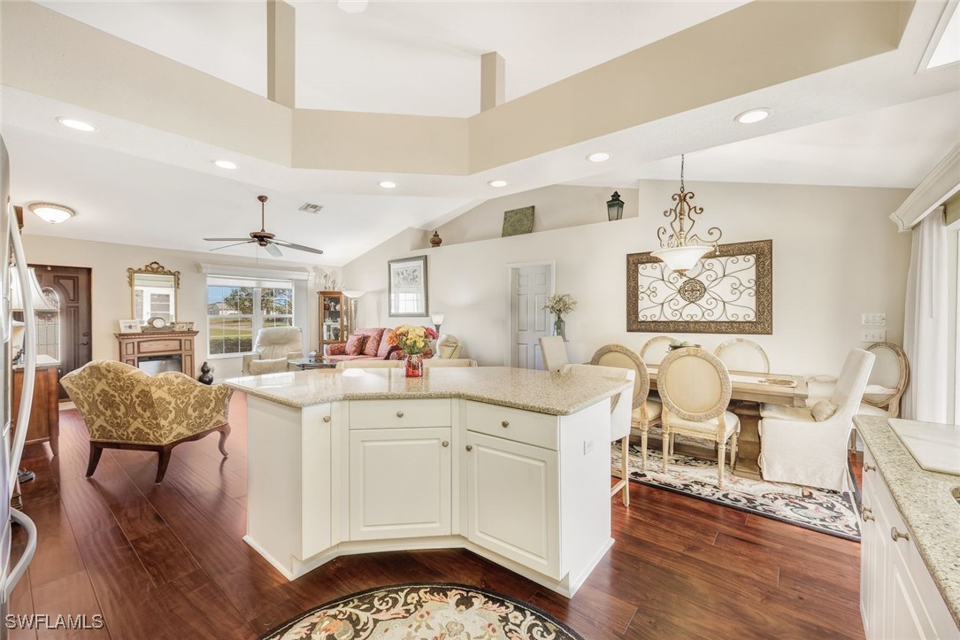 a large white kitchen with a large window