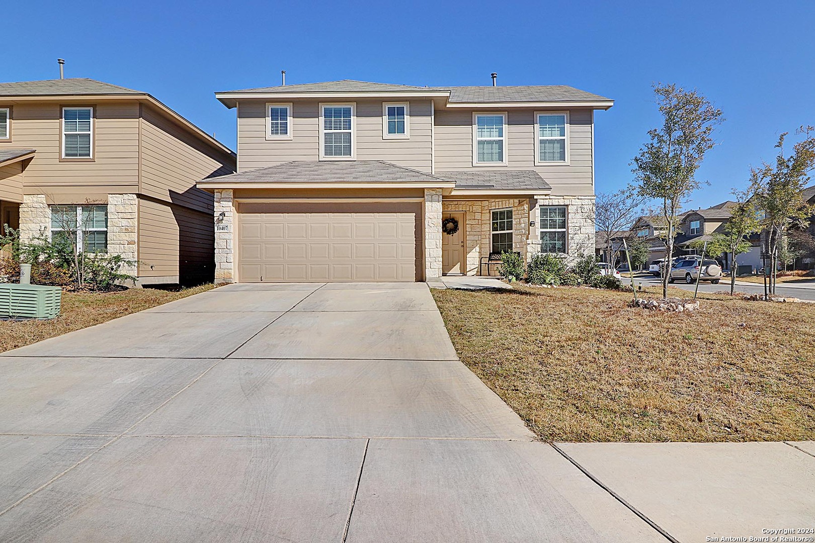 a front view of a house with a yard