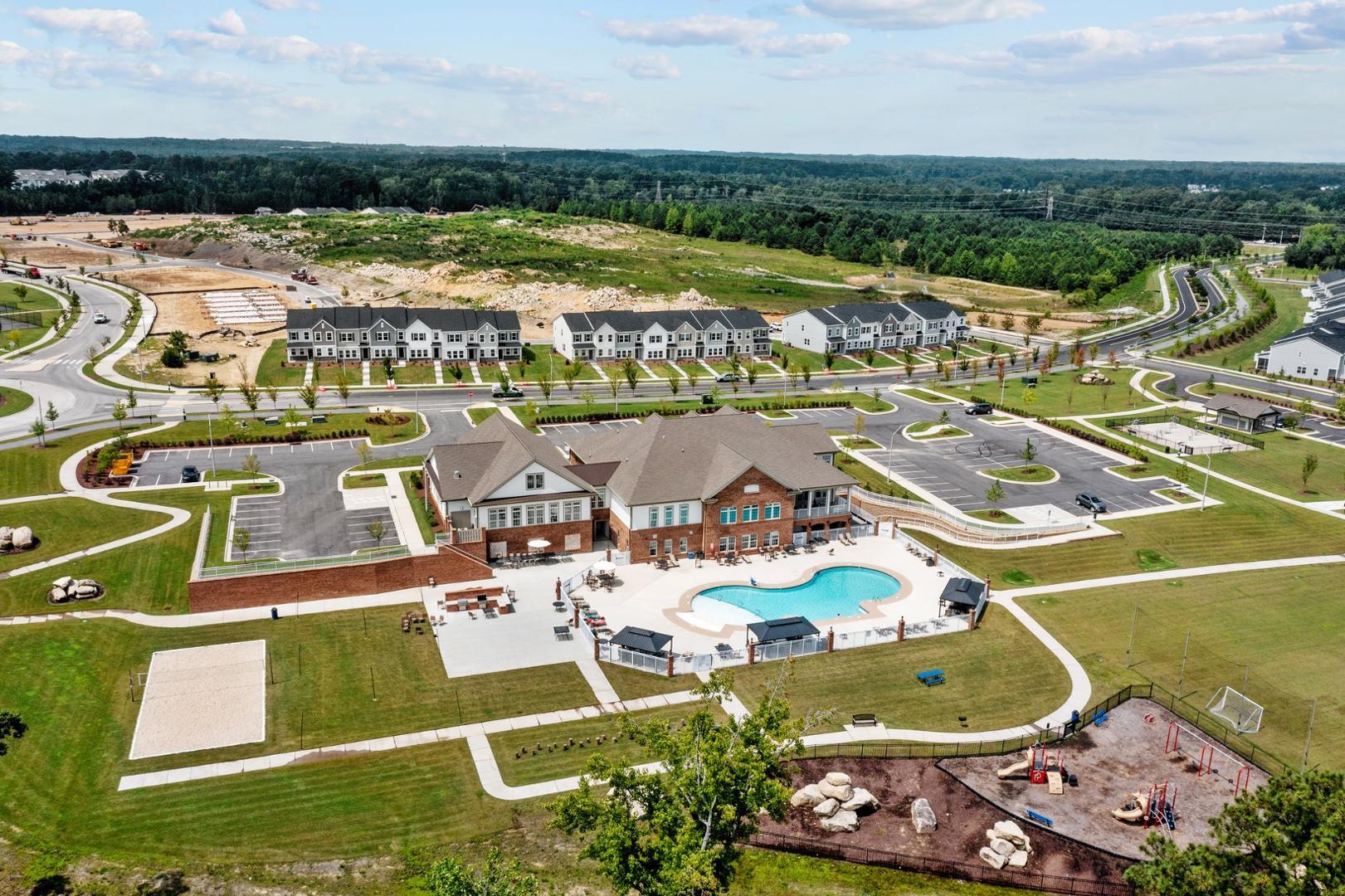 an aerial view of residential houses with outdoor space