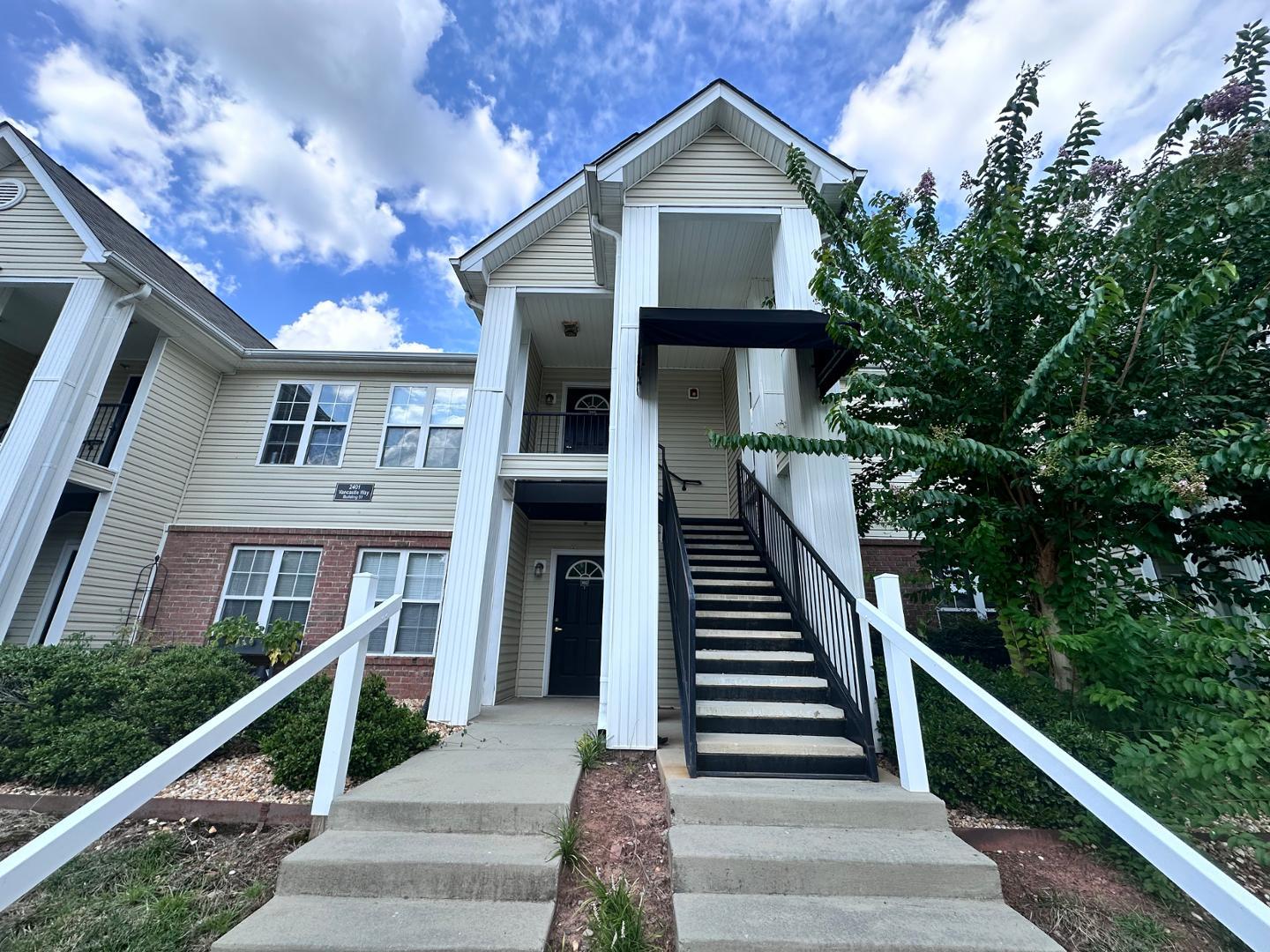 a front view of a house with stairs