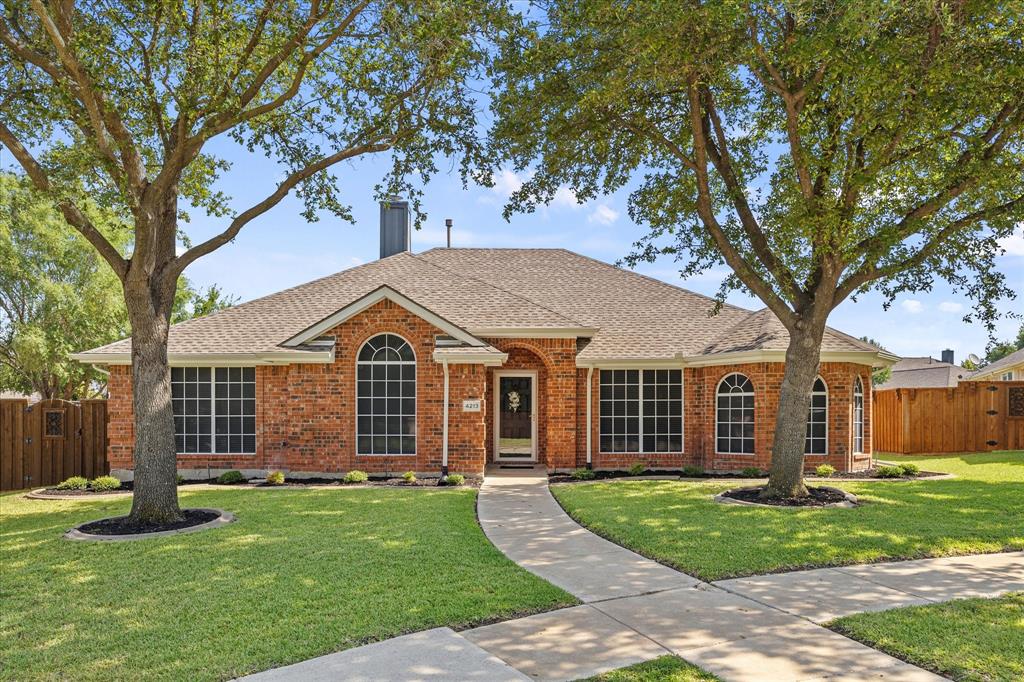 front view of a house with a yard