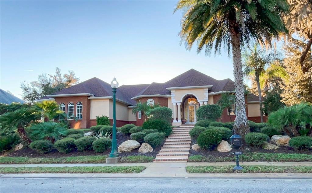 a front view of a house with garden