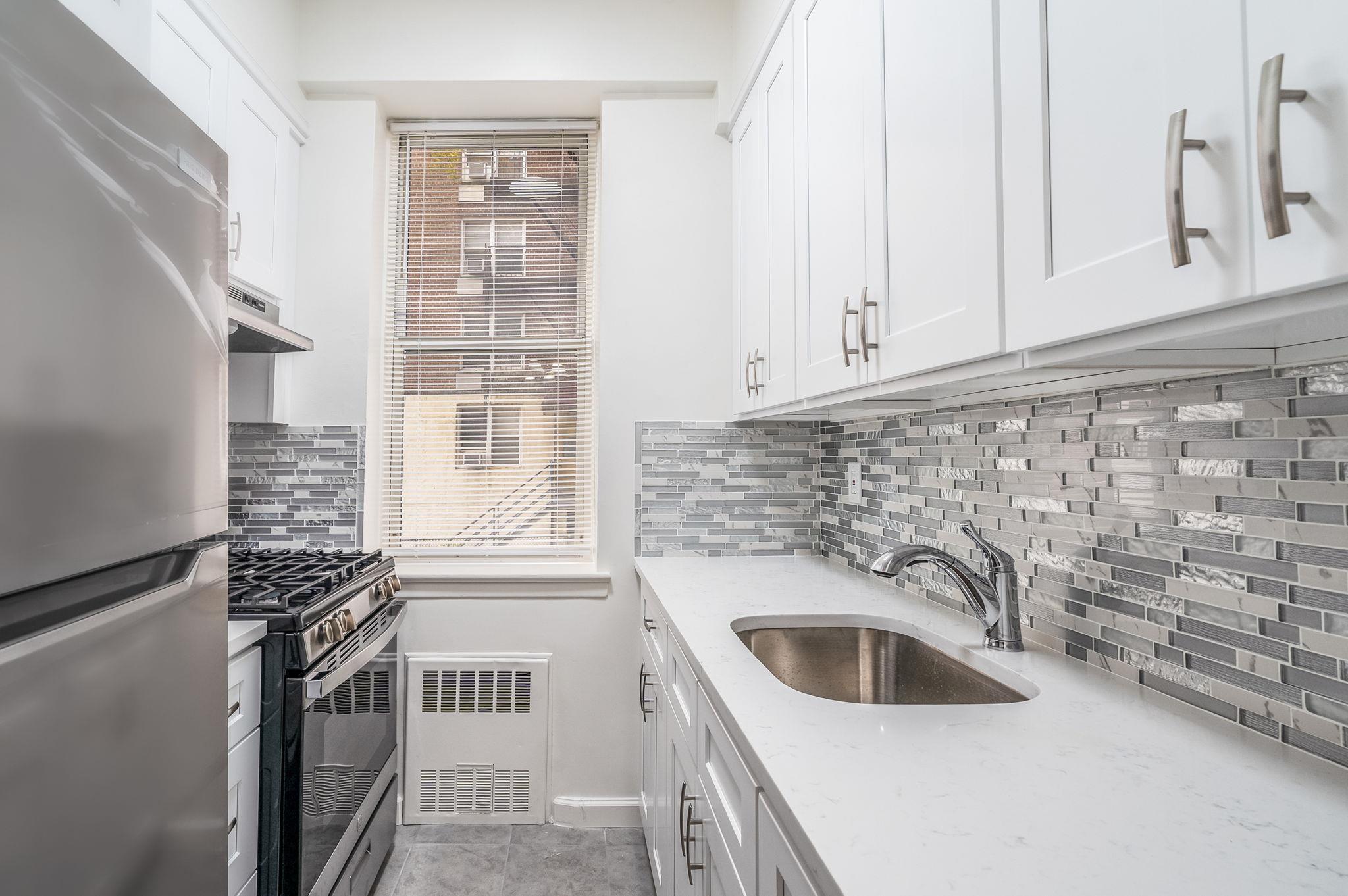 New kitchen with quartz counters and stainless-steel appliances