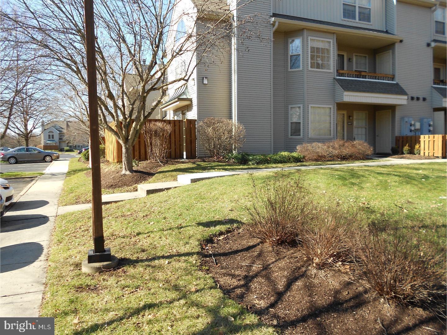 a view of a house with backyard and garden