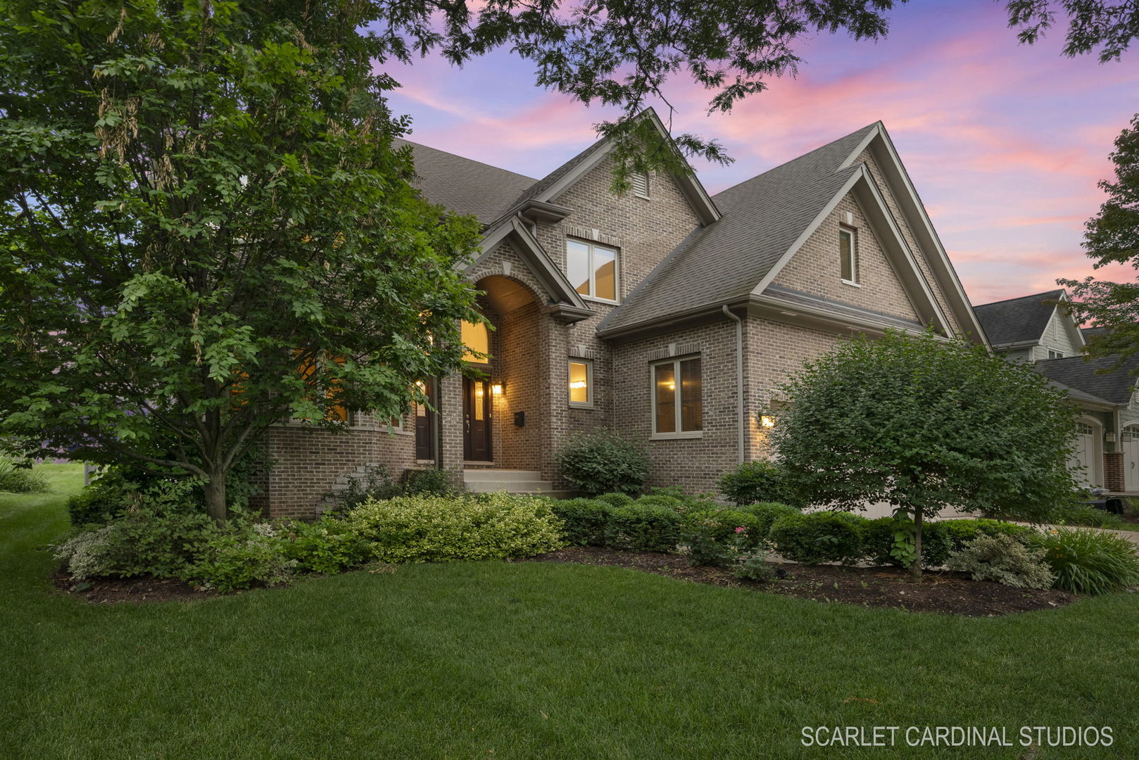 a front view of a house with a yard