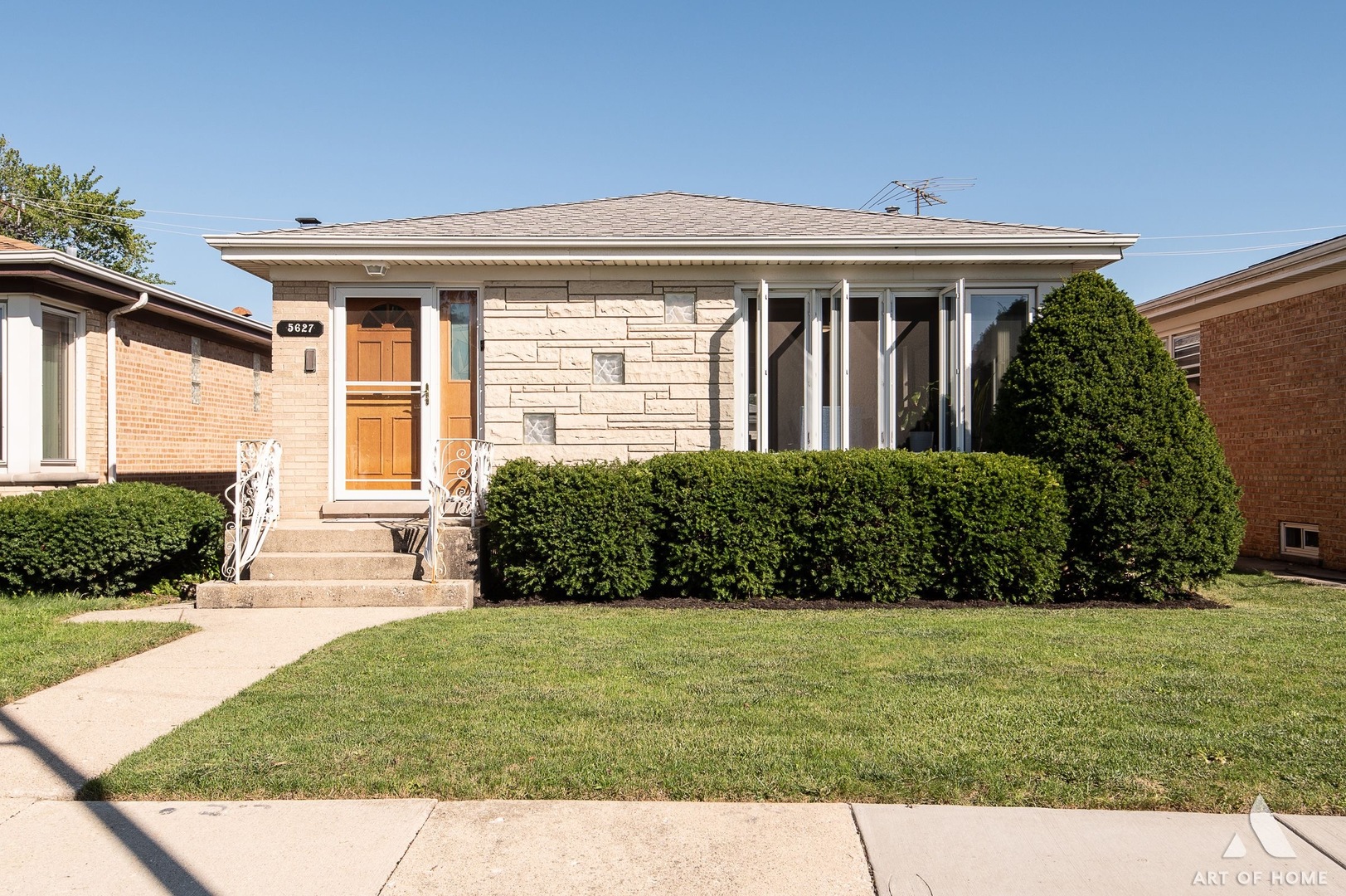 a front view of a house with a yard