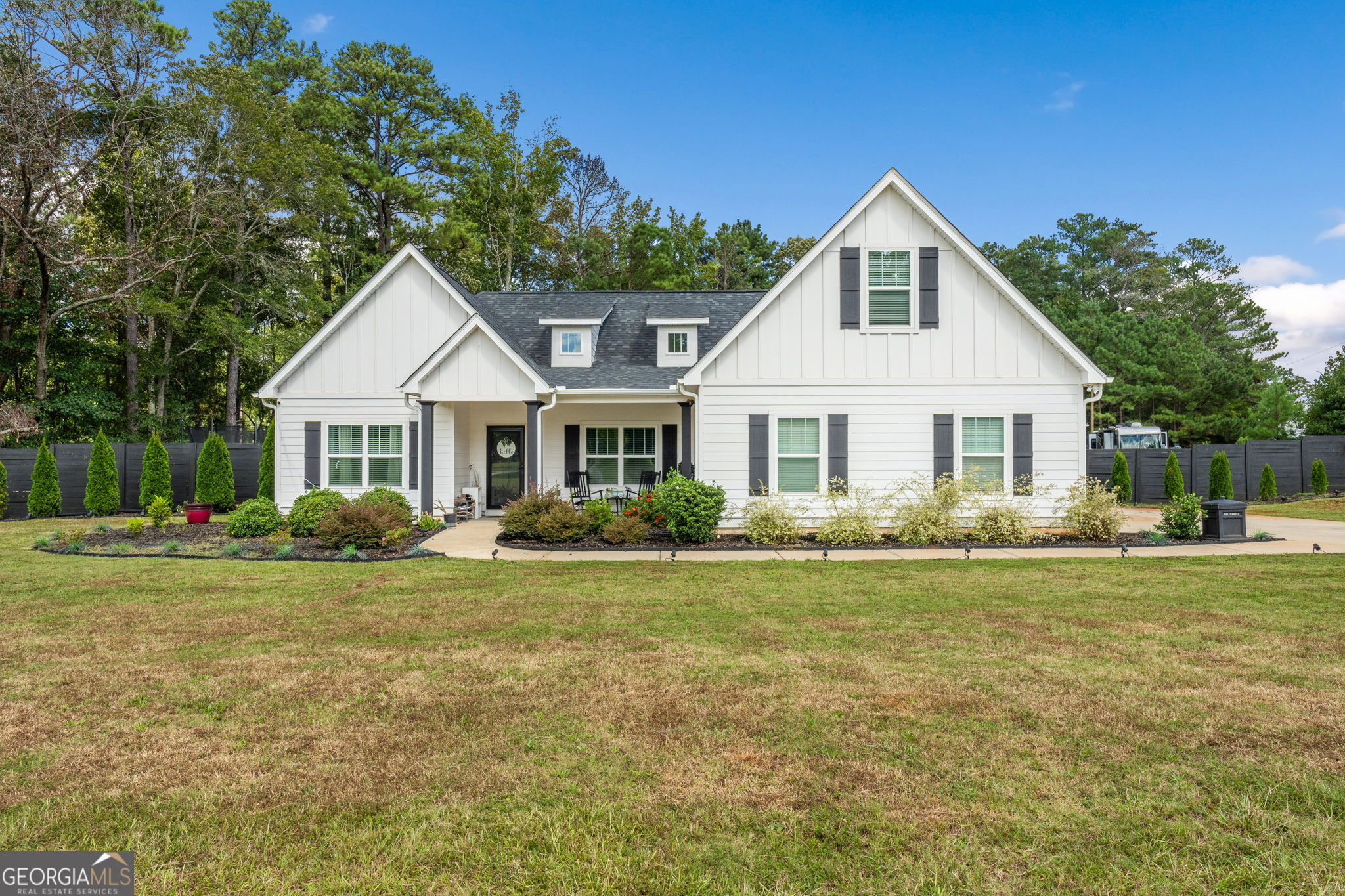 a front view of a house with a yard