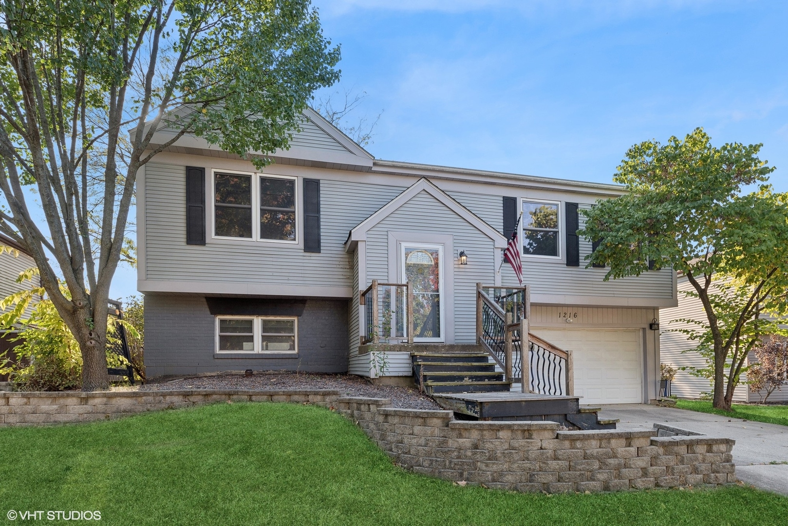 front view of a house with a yard