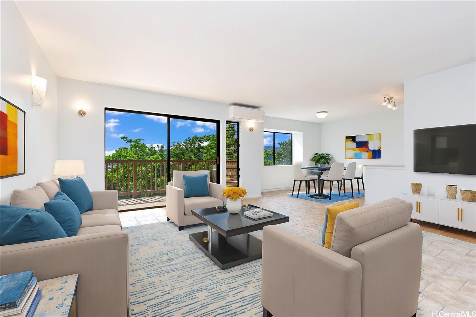 a living room with furniture and a flat screen tv