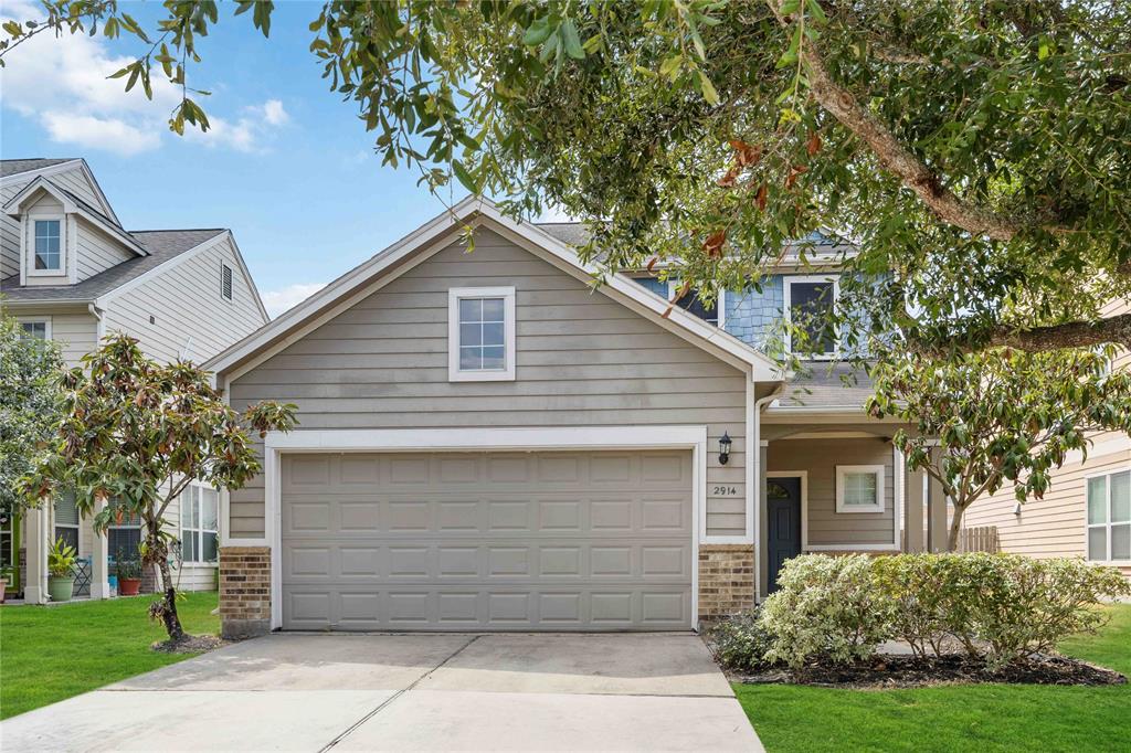 a front view of a house with a garage