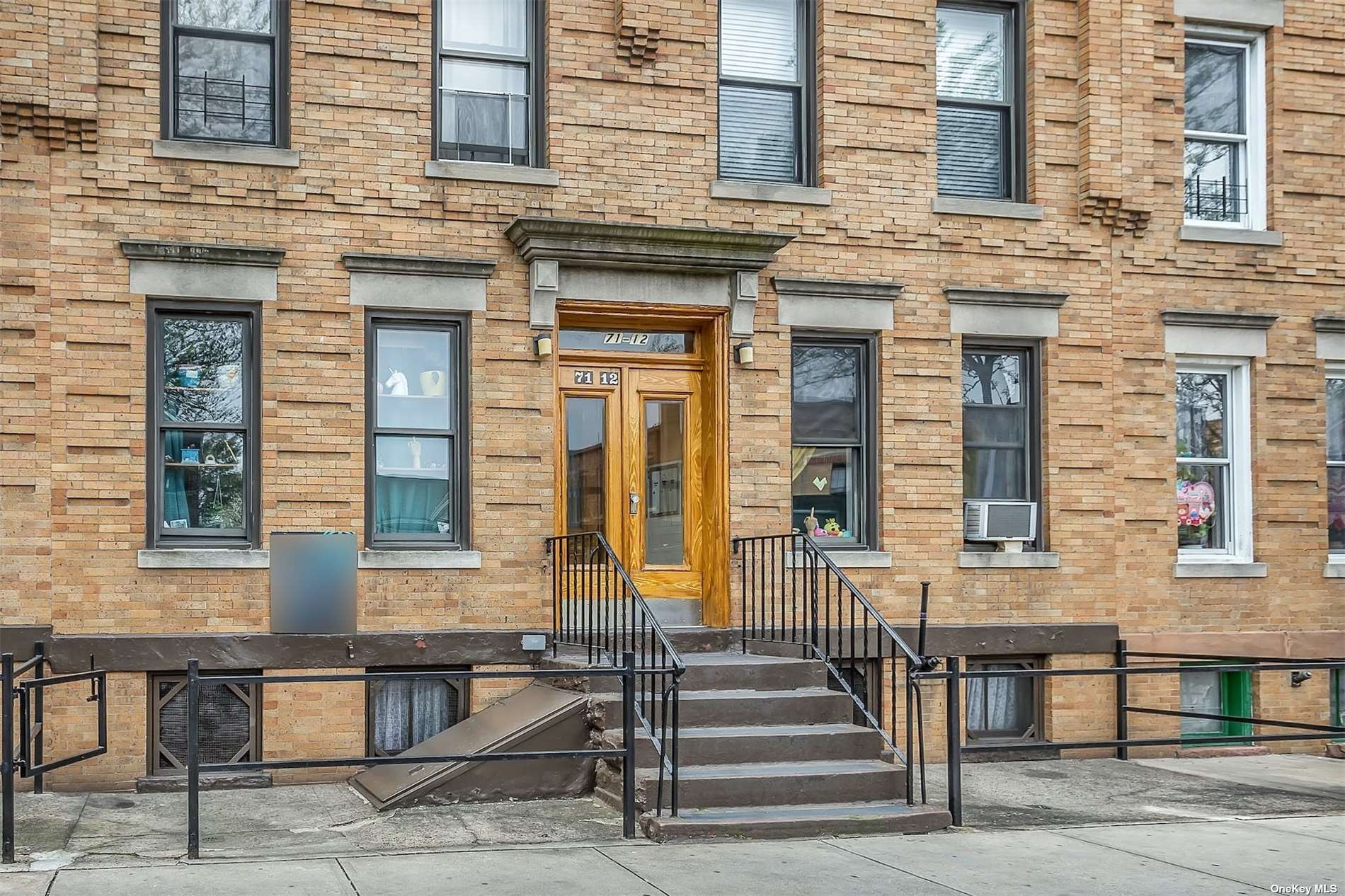 a front view of a building with stairs